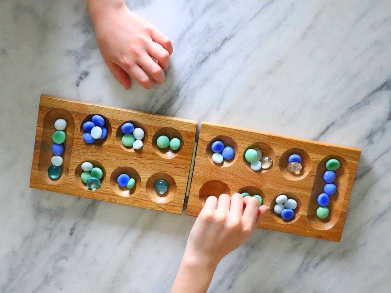 The board and card games mentioned in “Mermaid Princess Amelia and the Lost Symphony” by Maxine Foti